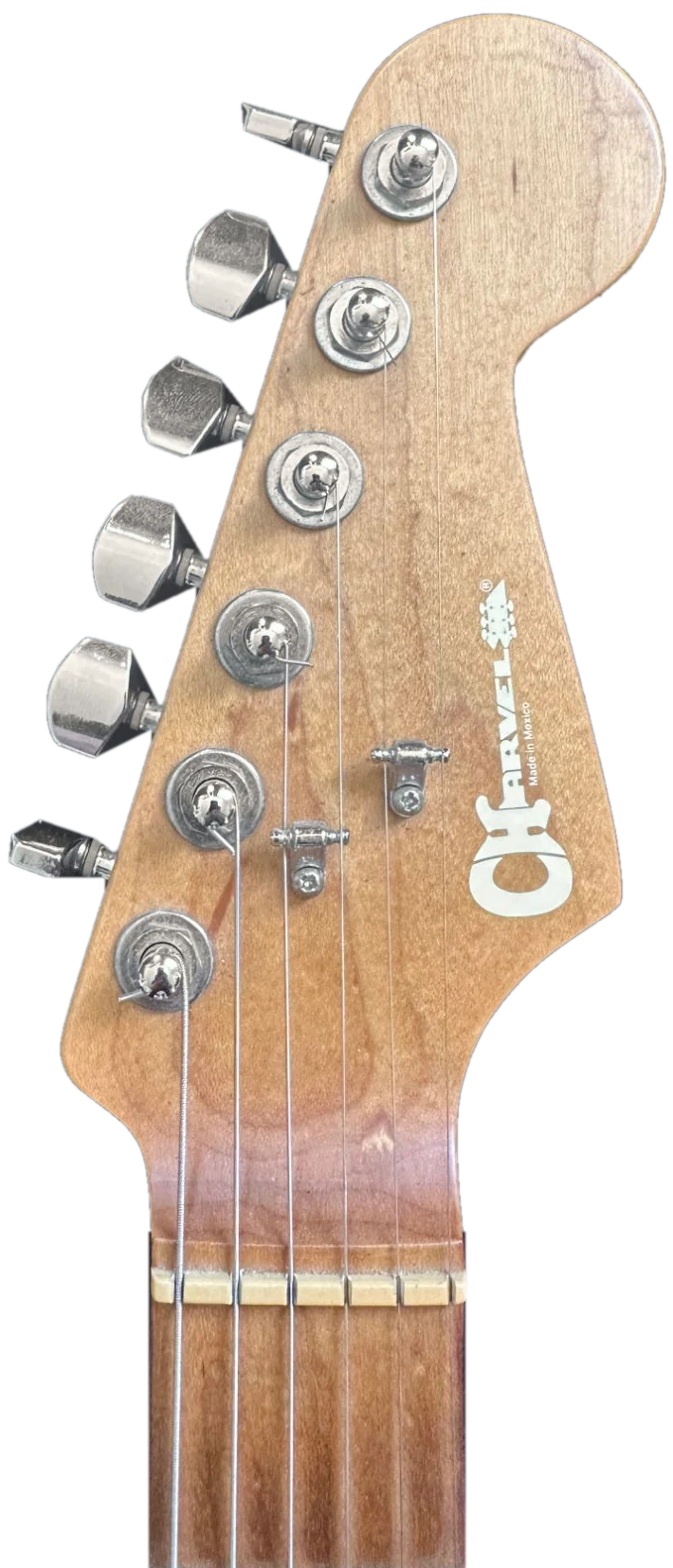 The headstock of Ruben's Charvel guitar: roasted maple, six tuners in a row